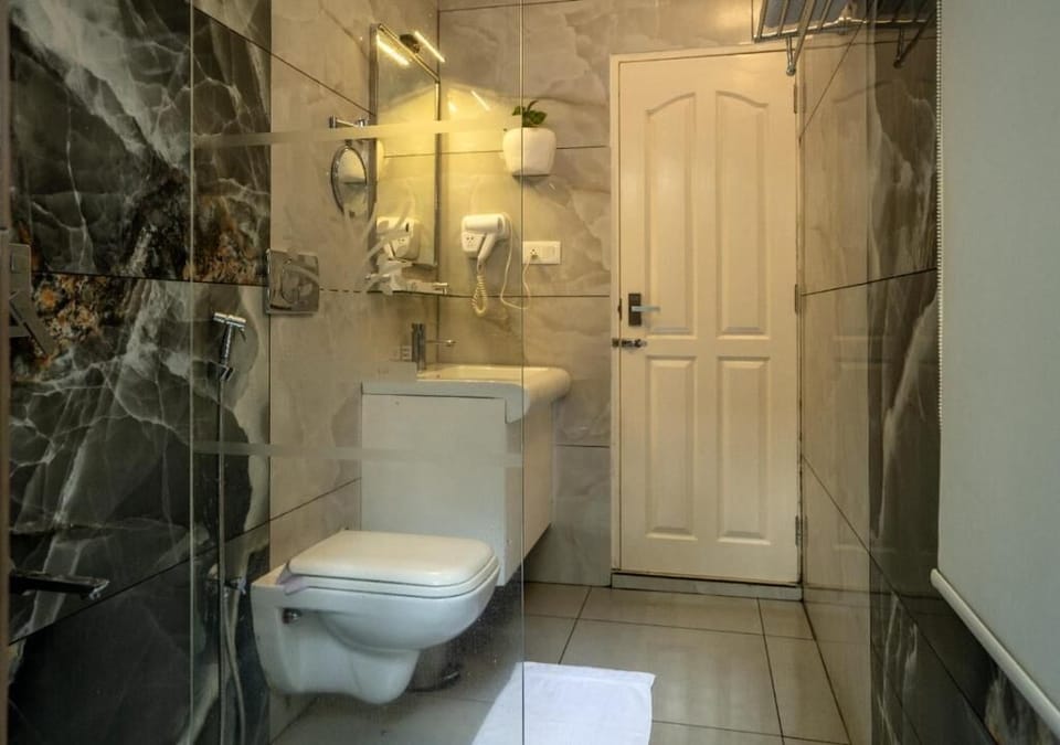 Garden Cove Cottage | Bathroom | Bathrobes, slippers, towels, soap