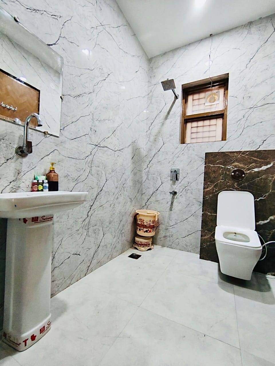 Shower, towels, toilet paper