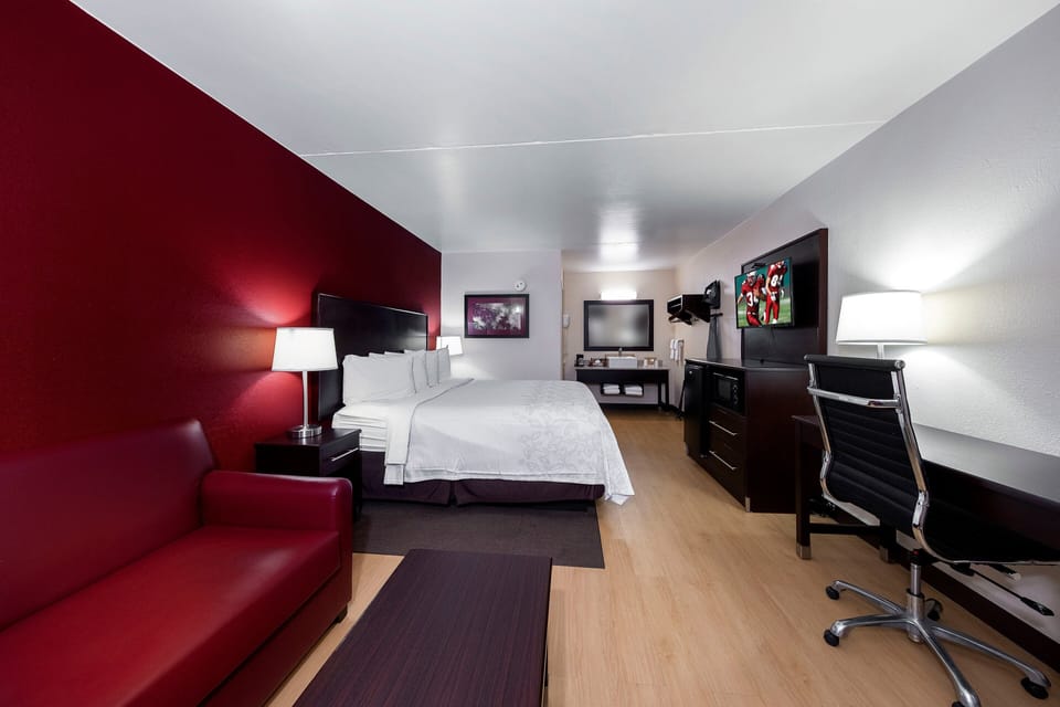 Desk, laptop workspace, blackout drapes, iron/ironing board