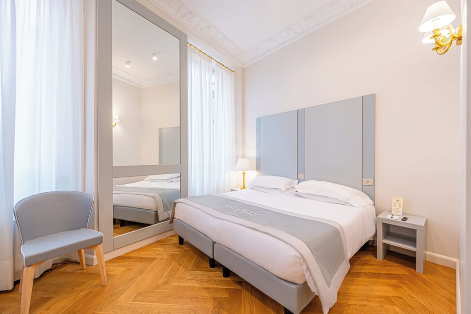 Triple Room | Down comforters, minibar, in-room safe, desk