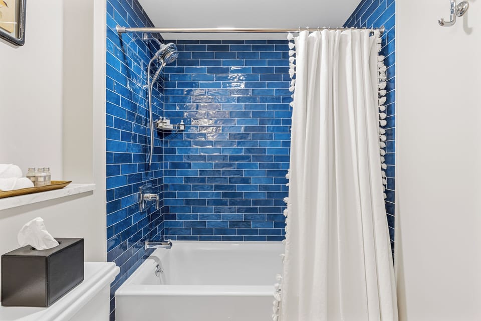Headmaster's Cottage - 1 King | Bathroom | Hair dryer, towels, soap, shampoo