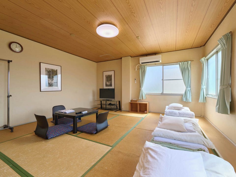 Japanese-style Triple Room, Smoking, Shared Bathroom (for 3 pax) | Down comforters, free WiFi, bed sheets