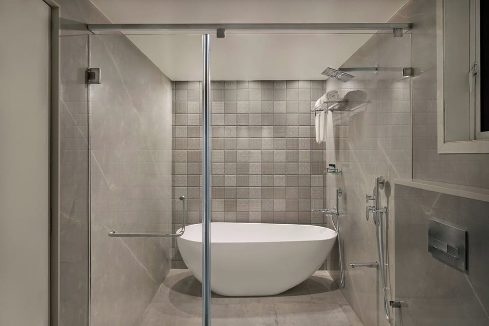Classic Suite, 1 King Bed, City View | Bathroom | Slippers