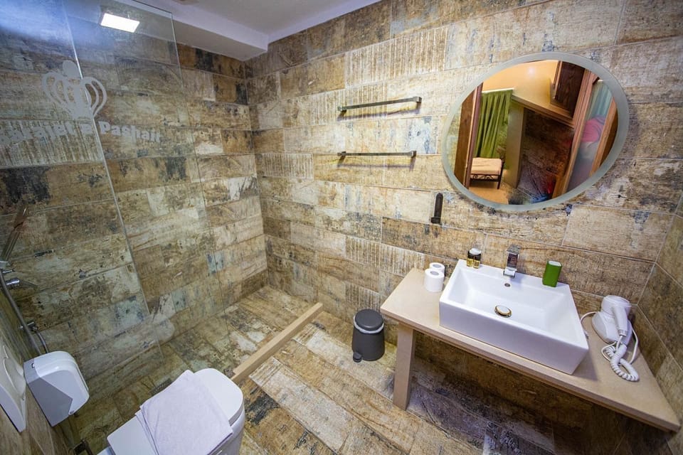 Shower, free toiletries, hair dryer, slippers