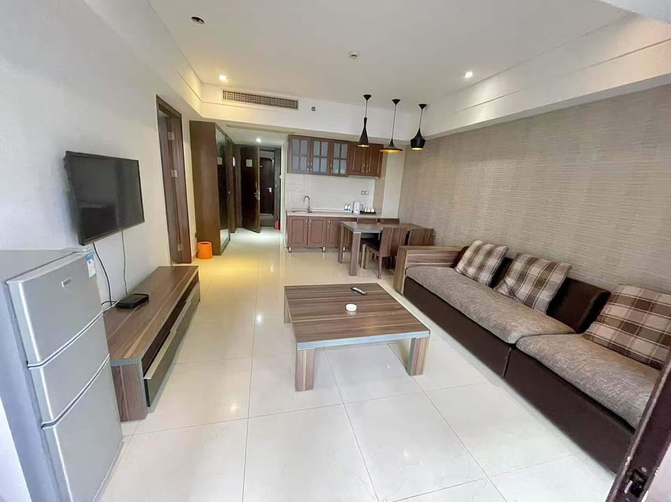 Luxury Suite, Balcony, Sea View | Living room | TV