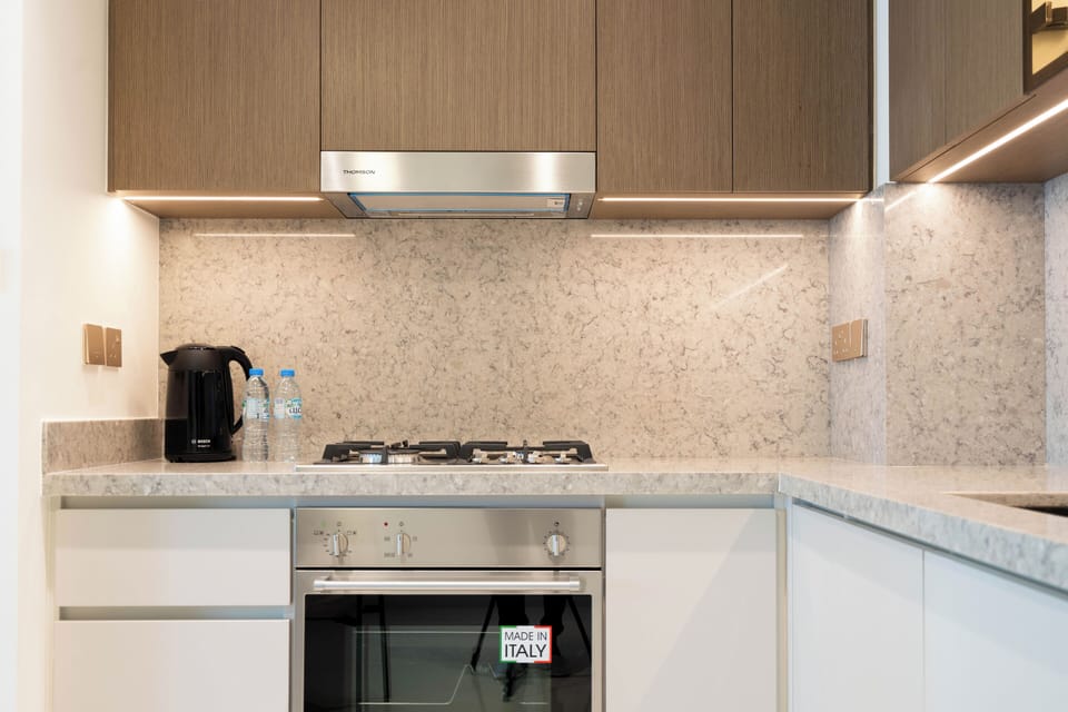 Deluxe Apartment, Balcony, Sea View | Private kitchen | Full-size fridge, microwave, oven, stovetop