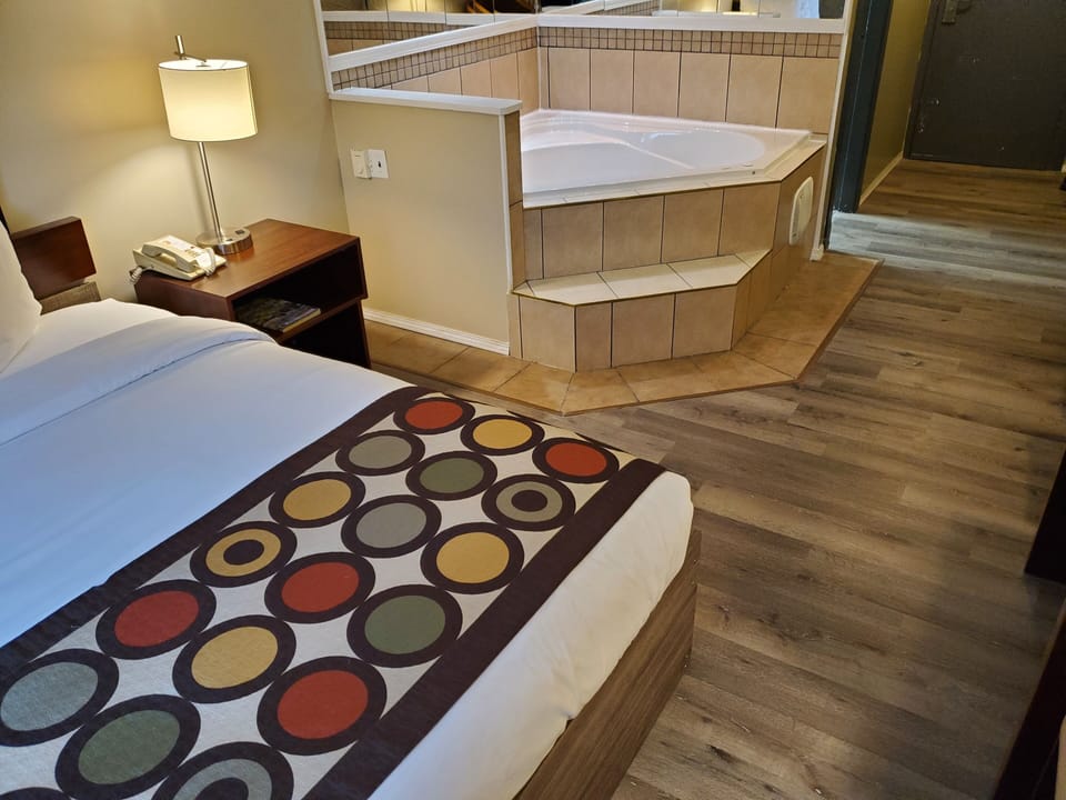 Suite, 1 Queen Bed, Non Smoking, Hot Tub | Desk, blackout drapes, iron/ironing board, free WiFi