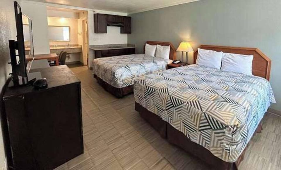 Standard Room, 2 Queen Beds, Non Smoking, Kitchen | Premium bedding, pillowtop beds, blackout drapes, iron/ironing board