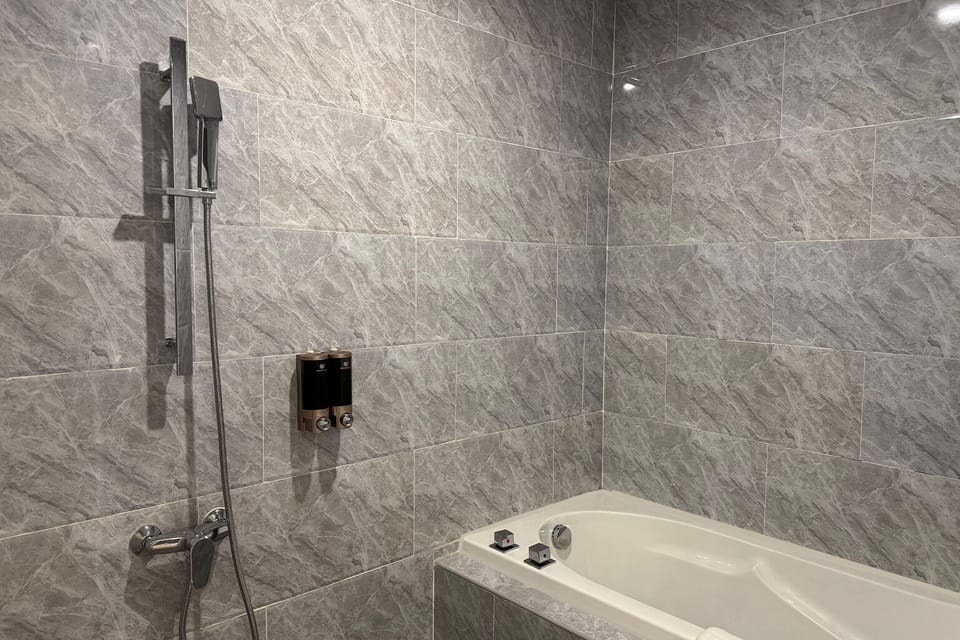 Hair dryer, slippers, towels, shampoo