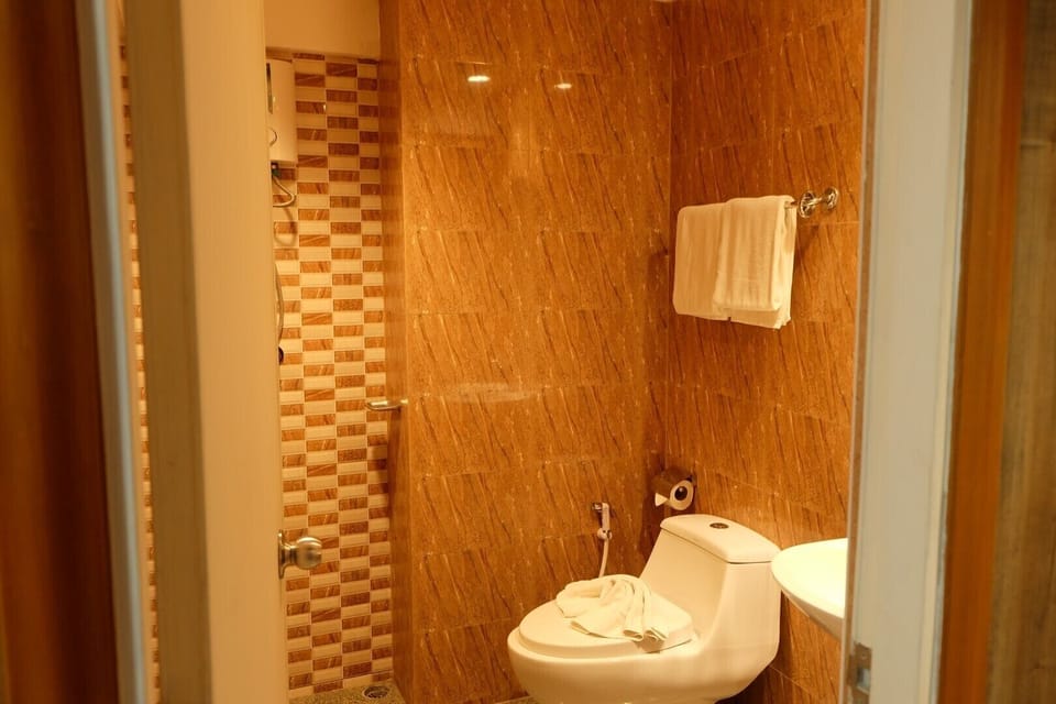 Designer toiletries, slippers, bidet, towels