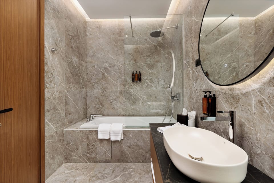 Combined shower/tub, eco-friendly toiletries, hair dryer, slippers