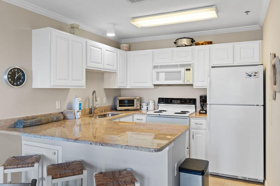 Condo, 1 Queen Bed with Sofa bed (Grand Caribbean West 311) | Private kitchen | Oven, toaster