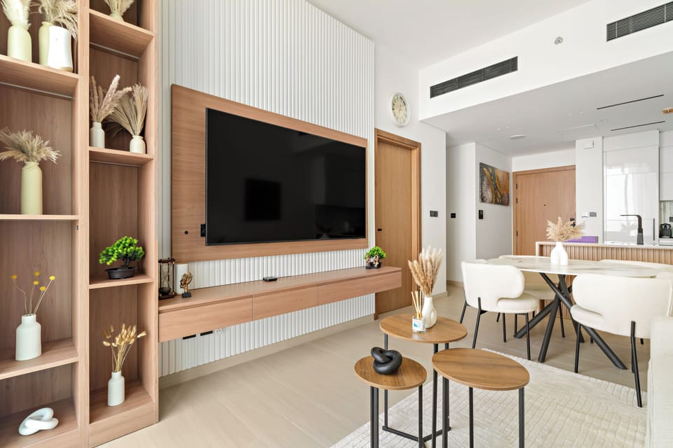 Signature Apartment | Living area | 50-inch Smart TV with digital channels