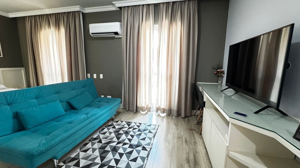 Deluxe Suite | Living area | 50-inch Smart TV with digital channels, offices