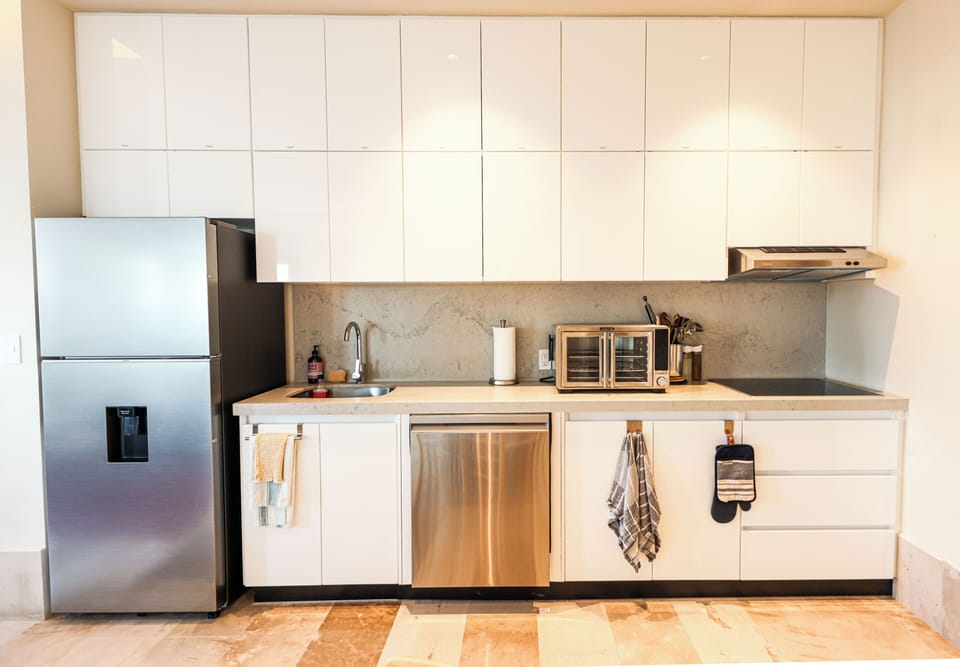 Comfort Apartment, Ocean View | Private kitchen | Full-size fridge, oven, stovetop, dishwasher