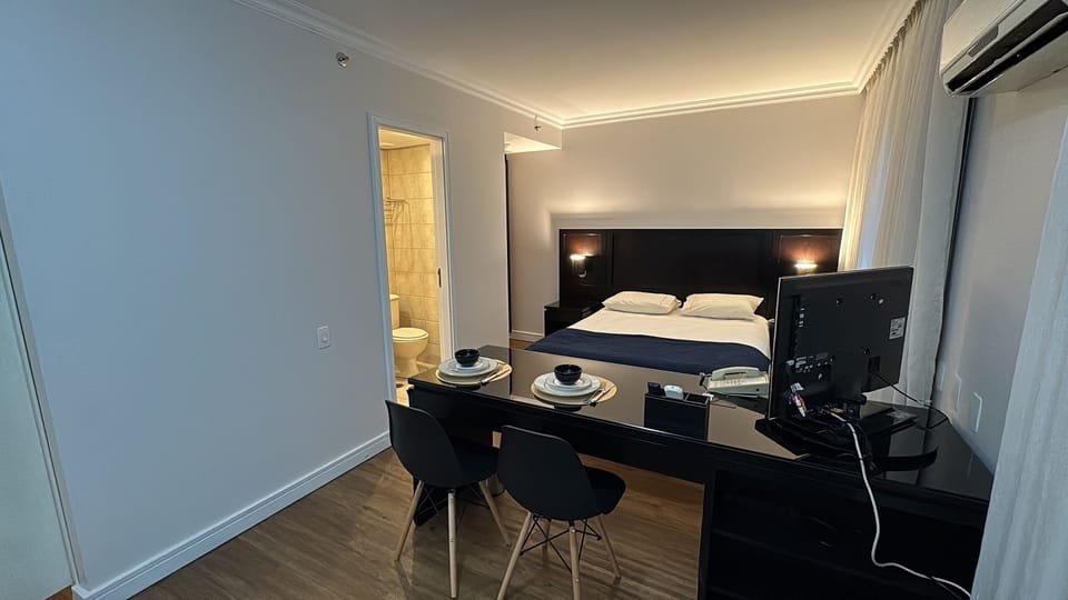 Deluxe Double Room | Minibar, desk, blackout drapes, iron/ironing board