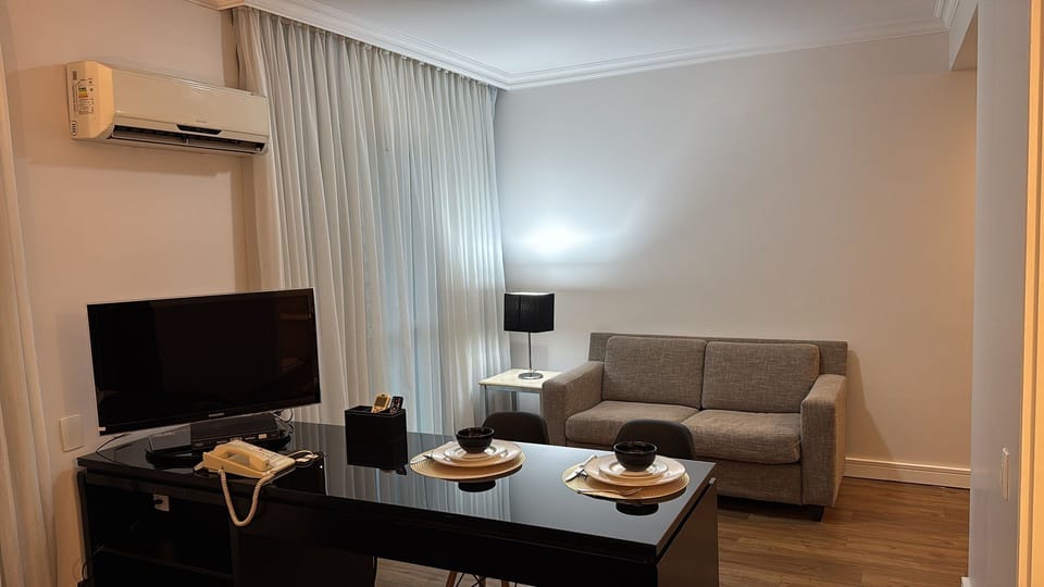 Deluxe Double Room | Living area | Smart TV