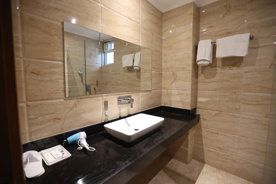 Rainfall showerhead, free toiletries, hair dryer, slippers
