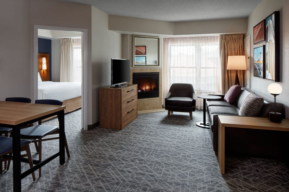 Suite, 2 Bedrooms | Living room | 32-inch flat-screen TV with satellite channels, TV, video-game console
