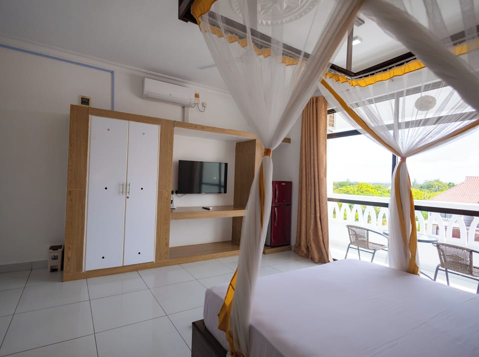 Deluxe Double or Twin Room, Balcony, Pool View | In-room safe, desk, laptop workspace, blackout drapes