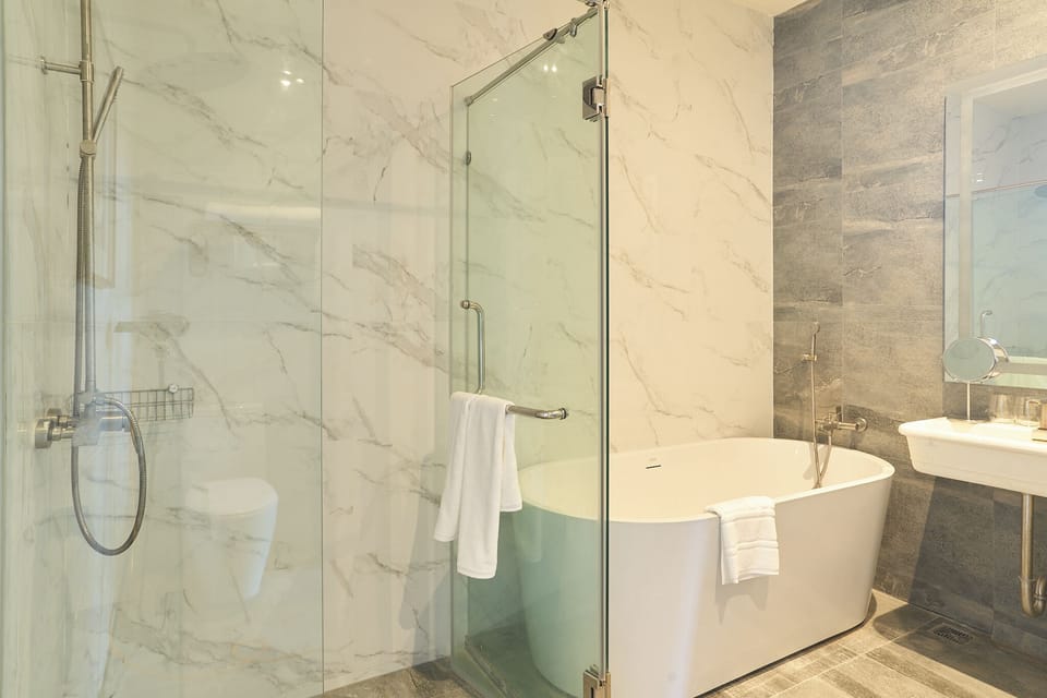 Tropical Penthouse | Bathroom | Separate tub and shower, rainfall showerhead, designer toiletries