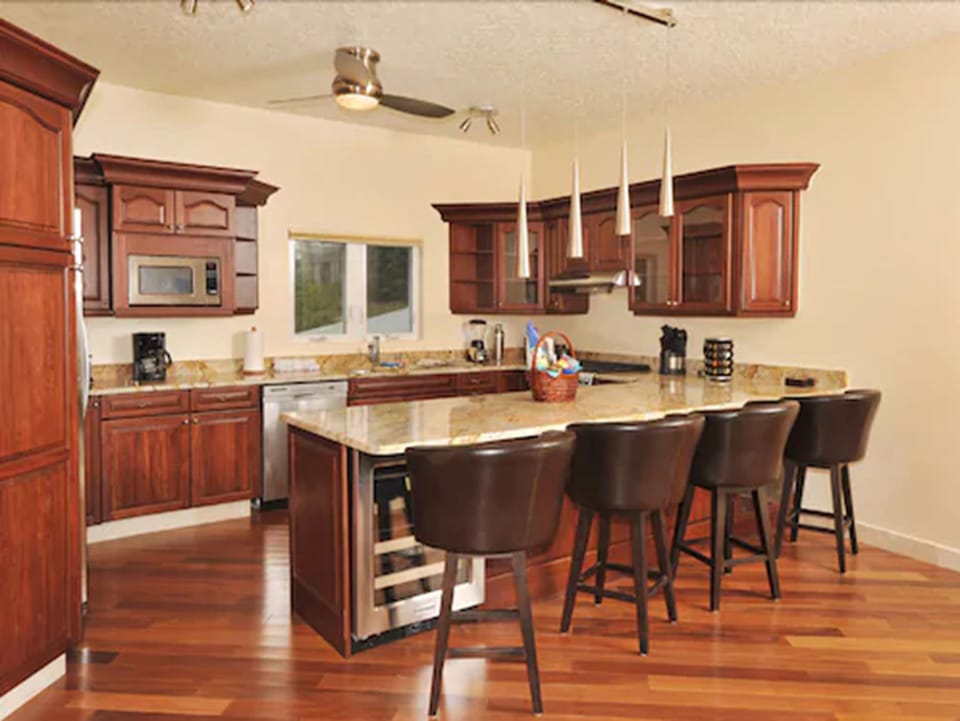 Deluxe Suite, 2 Bedrooms | Private kitchen | Full-size fridge, microwave, stovetop, dishwasher