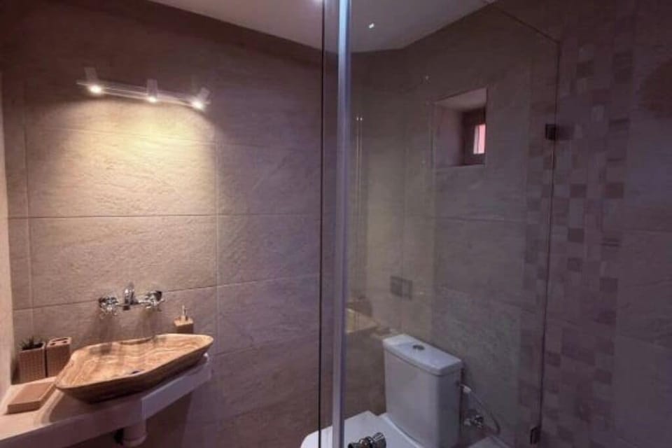 Shower, slippers, towels, soap