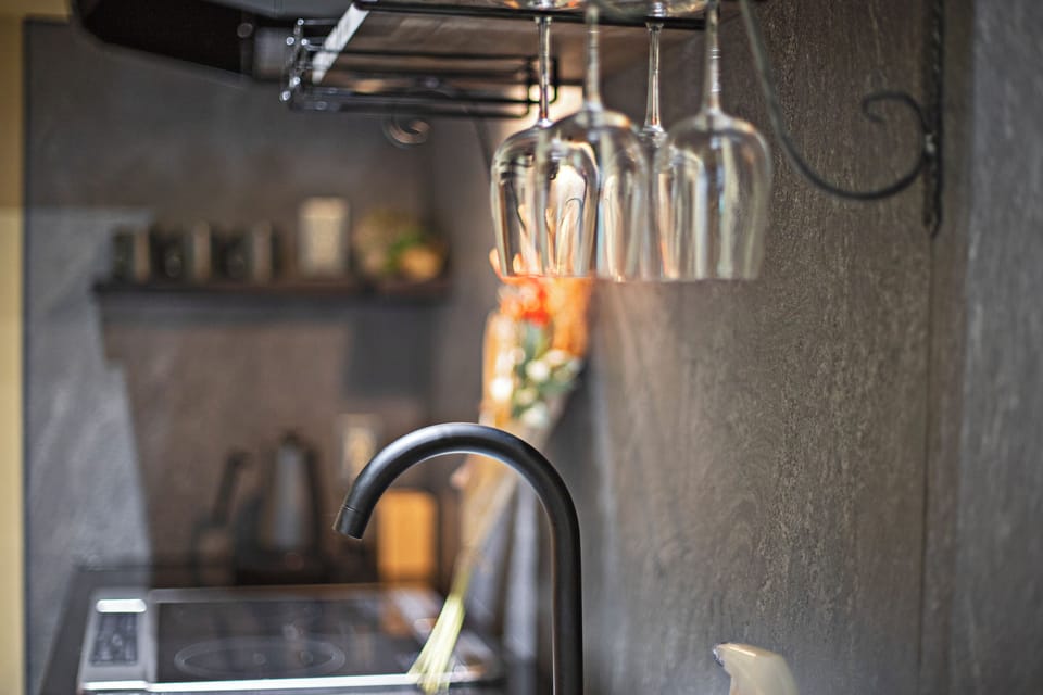 Bungalow | Private kitchen | Cookware/dishes/utensils, cleaning supplies, paper towels, dining table