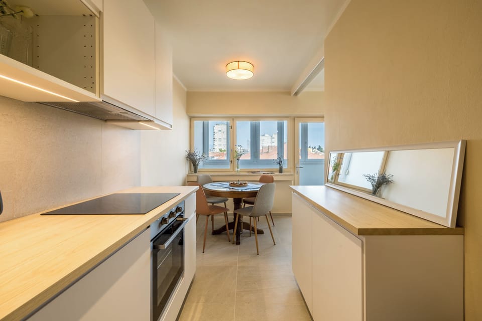 Classic Apartment, Sea View | Private kitchen | Highchair, dining tables