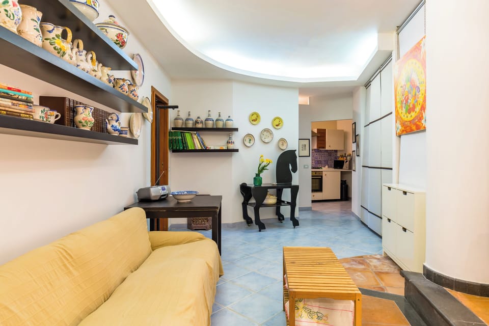 Apartment (1 Bedroom) | Living area | 32-inch Smart TV with cable channels