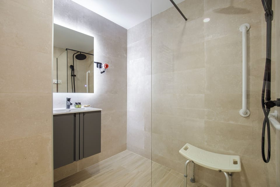 Double Room, Mobility Accessible | Bathroom | Shower, hair dryer, towels, soap