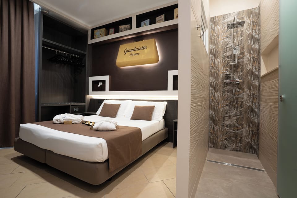 Superior Double Room (Sogno Gianduiotto) | Bathroom | Deep soaking tub, rainfall showerhead, free toiletries, hair dryer