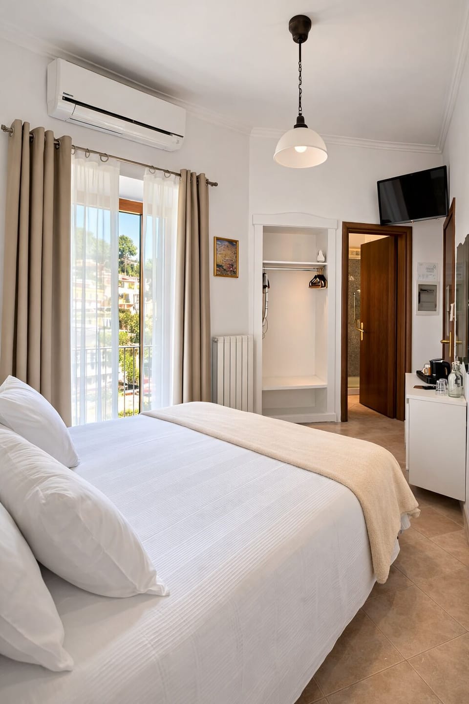 Economy Room, Balcony | Minibar, in-room safe, blackout drapes, iron/ironing board
