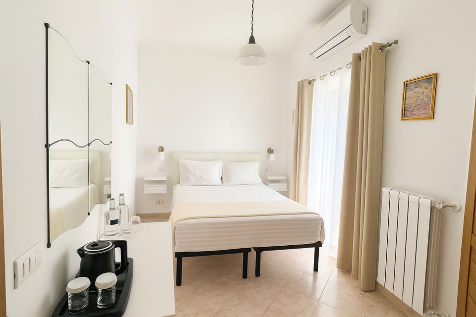 Economy Room, Balcony | Minibar, in-room safe, desk, blackout drapes