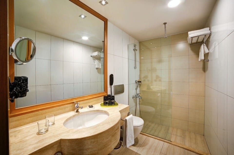 Shower, free toiletries, hair dryer, slippers