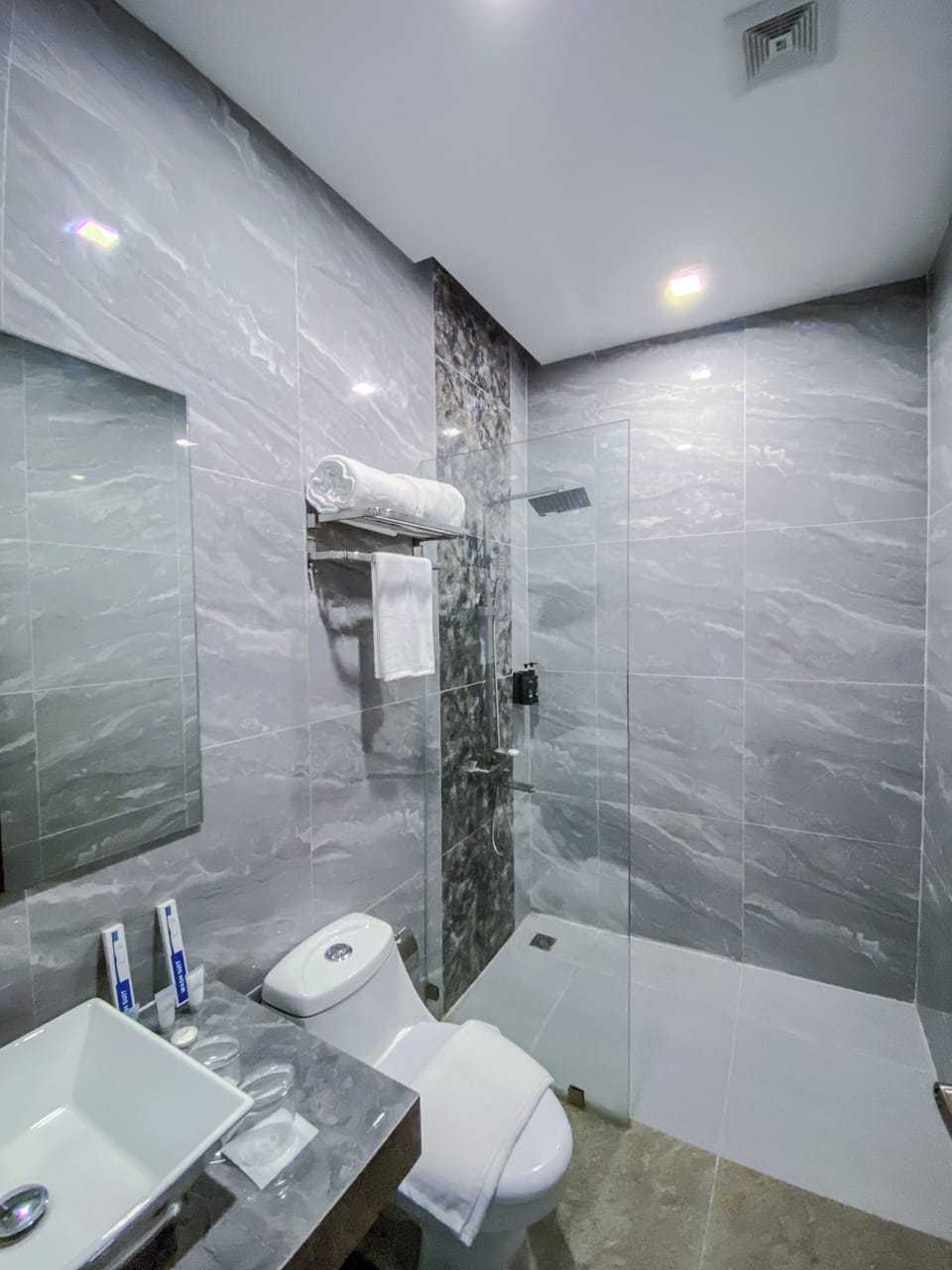 Shower, free toiletries, slippers, towels