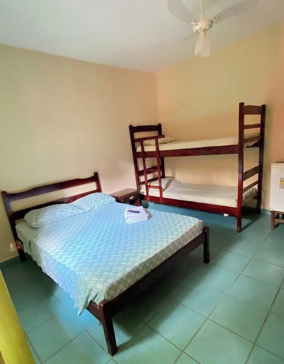 Economy Quadruple Room | Laptop workspace, bed sheets
