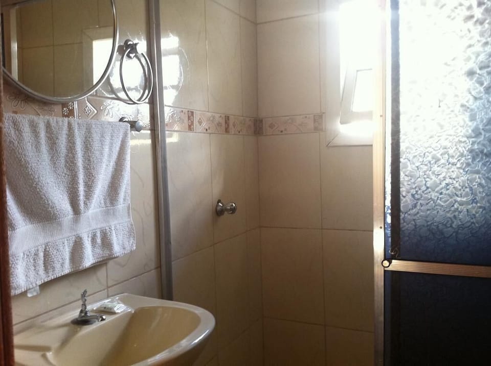 Basic Double Room | Bathroom | Shower, towels, soap, toilet paper