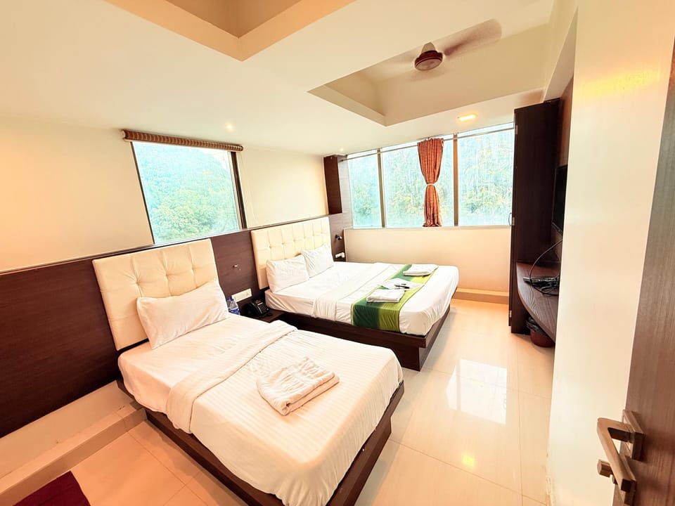 Deluxe Triple Room, City View | Iron/ironing board, free WiFi