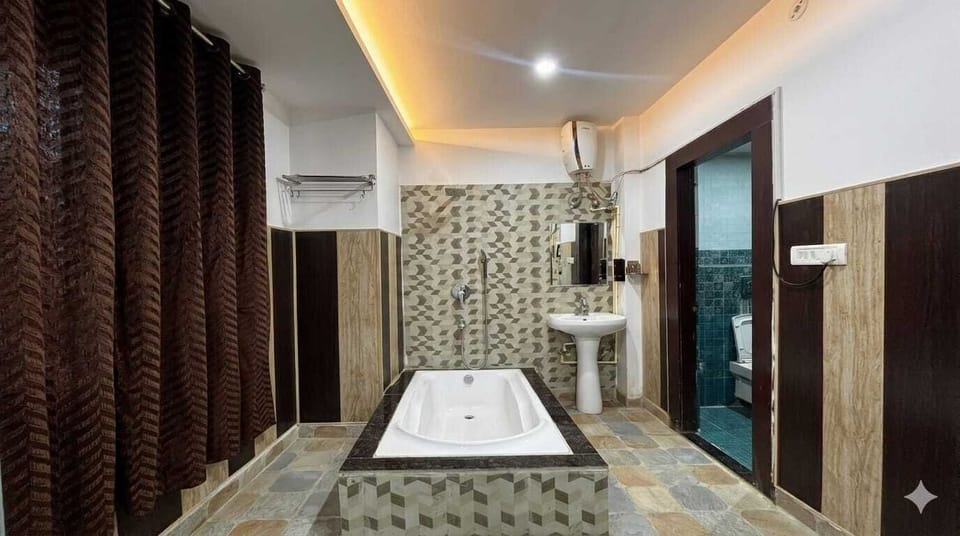 Luxury Studio Suite | Bathroom | Hair dryer, slippers, towels, soap