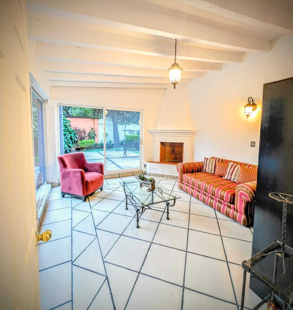 Deluxe Suite, Garden View | Living area | 30-inch Smart TV with cable channels