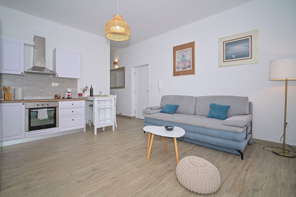 Apartment | Living area | 32-inch flat-screen TV with cable channels