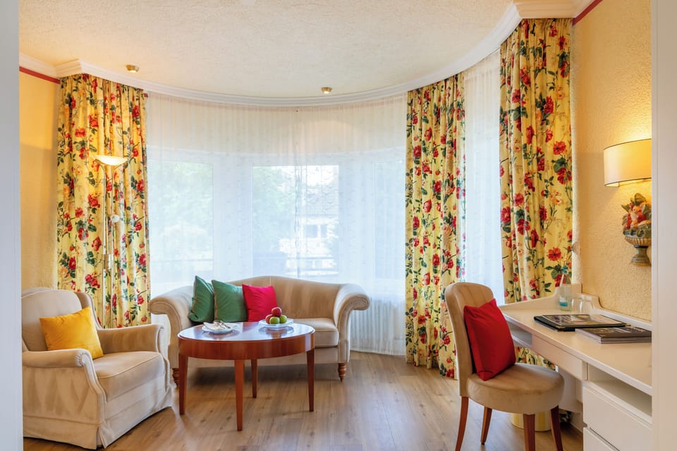 Suite, Balcony, Garden View | Living area | 45-inch TV with cable channels