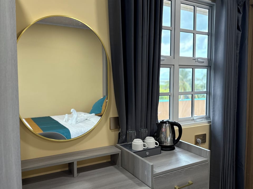 Deluxe Double Room, Balcony, Ocean View | In-room safe, laptop workspace, blackout drapes, iron/ironing board