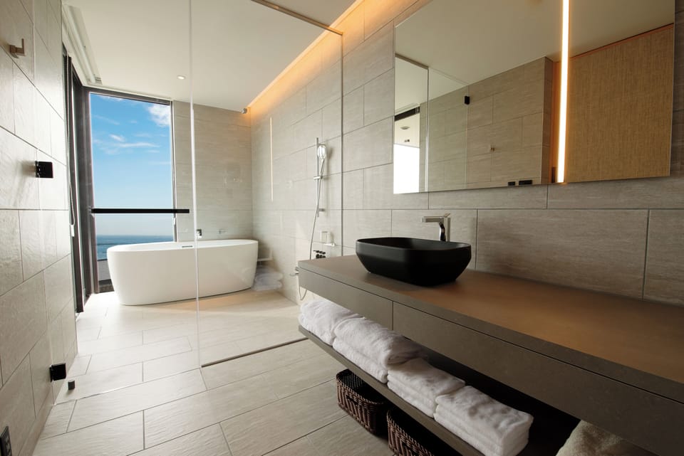 Junior Suite, Ocean View | Bathroom | Separate tub and shower, free toiletries, hair dryer, slippers