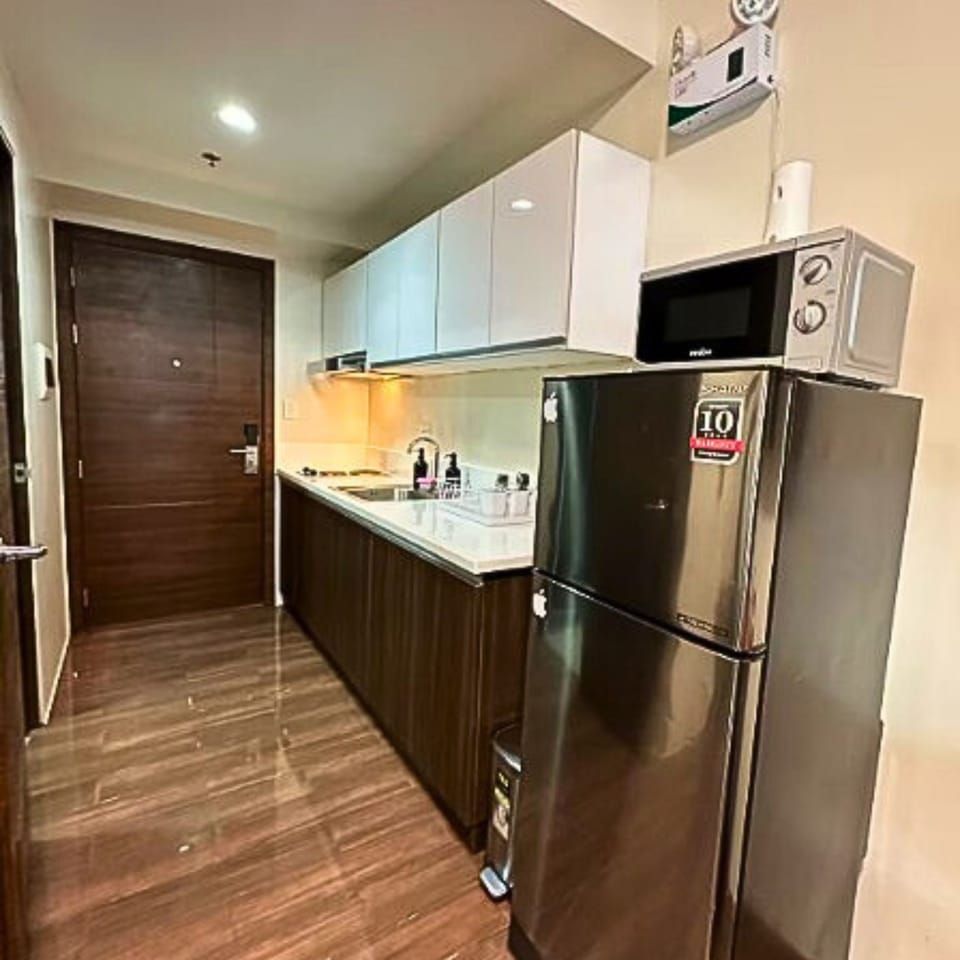 Suite, Balcony, Pool View | Private kitchen