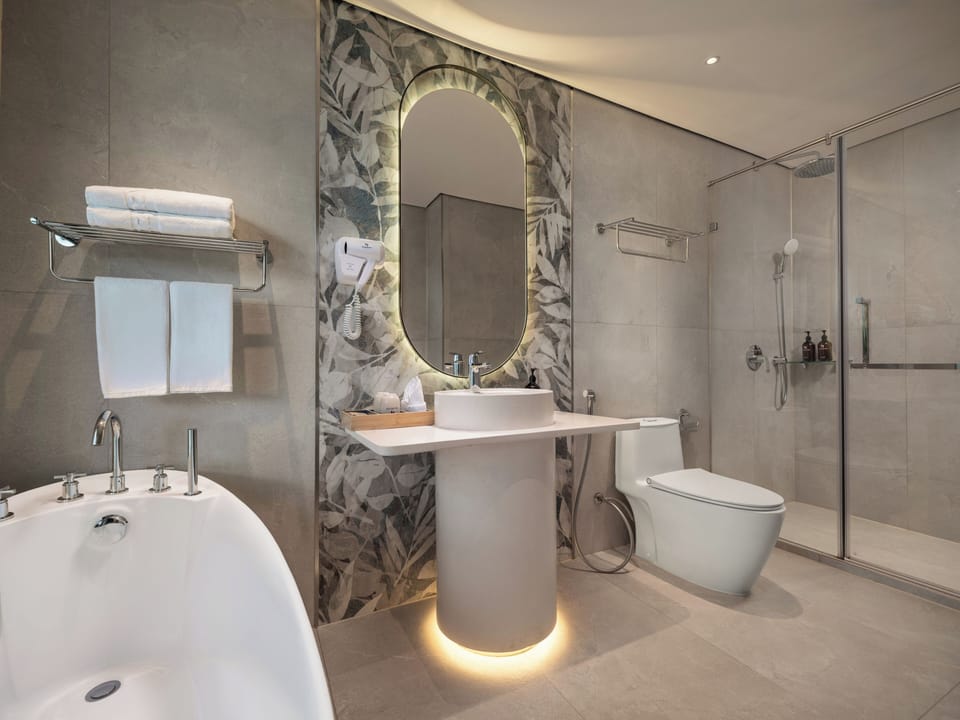 Separate tub and shower, free toiletries, hair dryer, slippers