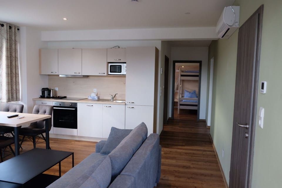Family Apartment, Balcony | Living area | 42-inch Smart TV with satellite channels