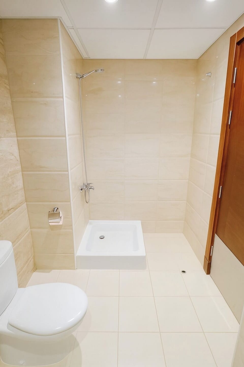 Shower, hair dryer, slippers, towels