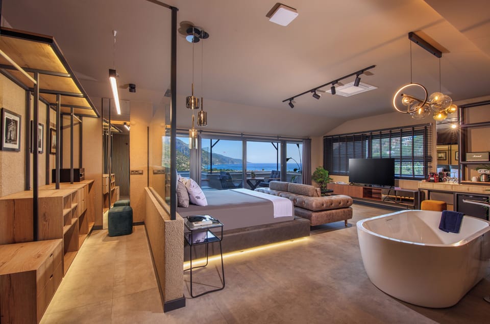 Executive Studio Suite, Sea View | Minibar, in-room safe, individually decorated, individually furnished